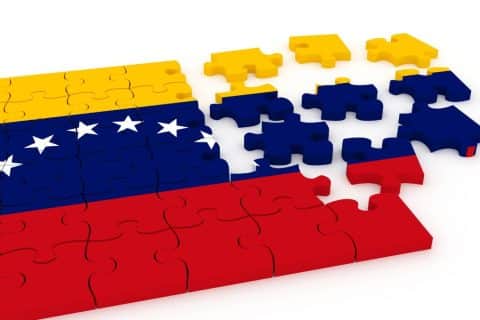 Bandeira da Venezuela formada por peças de quebra-cabeça, imagem simbólica sobre crise política e esforços de estabilização no país